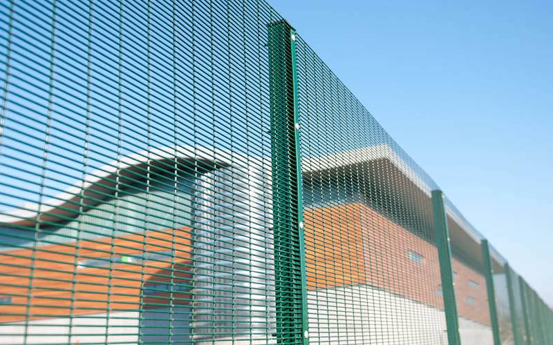 Several pieces of 358 high security fencing is protecting office building.